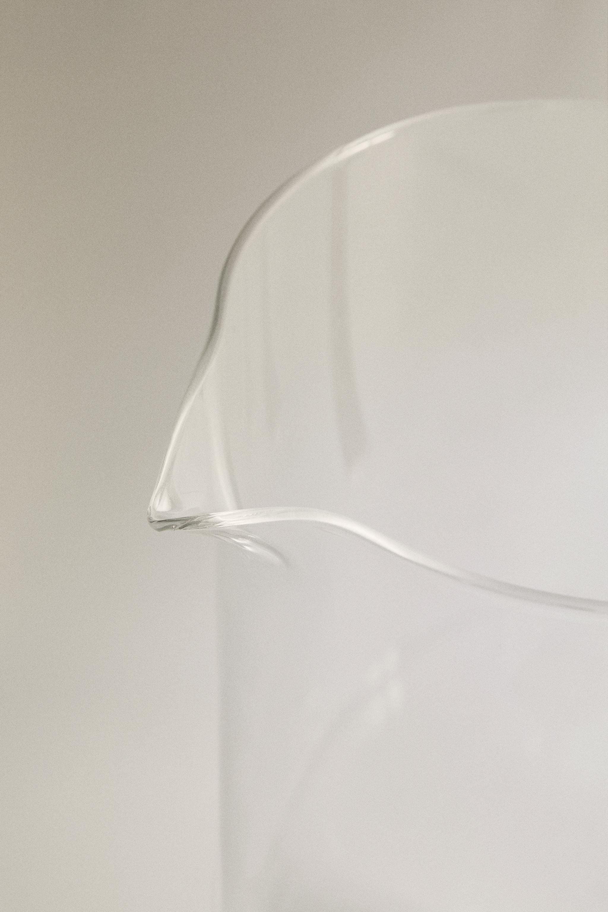 GLASS PITCHER WITH A HANDLE AND ORANGE DETAIL